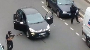 Still image taken from amateur video shows gunmen fleeing the offices of French satirical newspaper Charlie Hebdo, after killing at least 12, in Paris